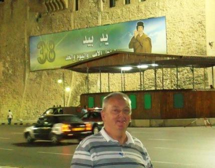 Tripoli central square by night. The Colonel on the wall.